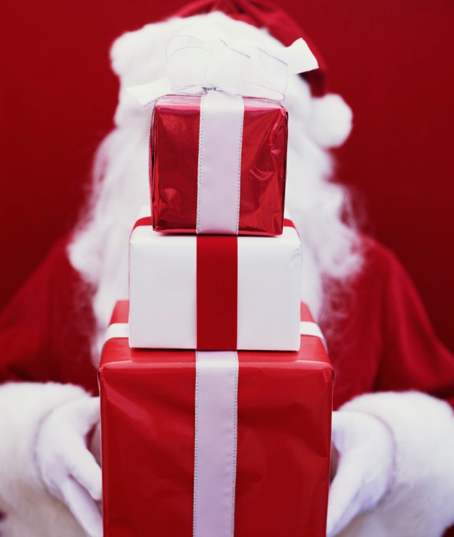 Santa Holding Stack of Gifts